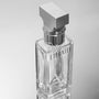 a bottle of perfume sitting on top of a table