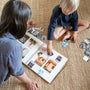 a couple of kids that are sitting on the floor