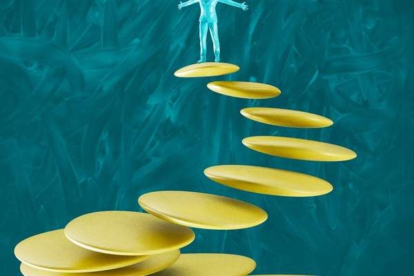 a man standing on top of a set of yellow plates