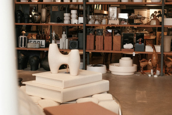 A shop showcases elegant home decor and goods.
