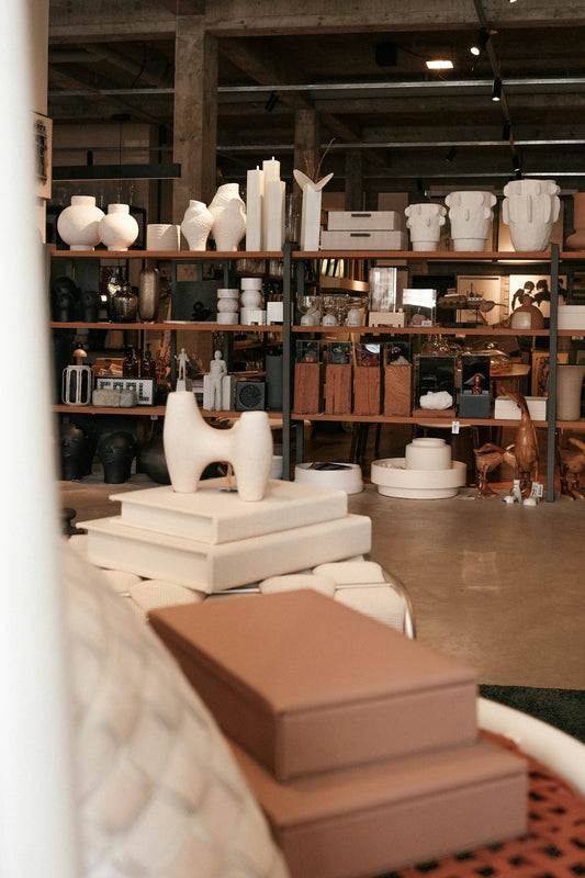 A shop showcases elegant home decor and goods.
