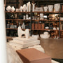 A shop showcases elegant home decor and goods.