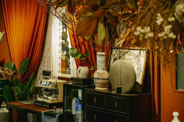 A dark room is decorated with autumnal decor.