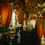A dark room is decorated with autumnal decor.