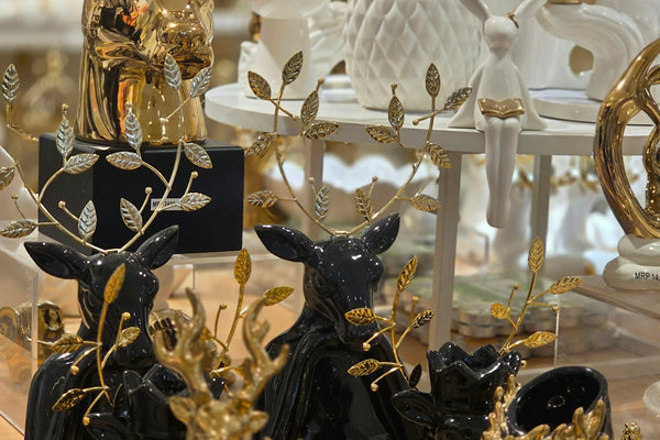 Decorative golden and black animal sculptures on display.