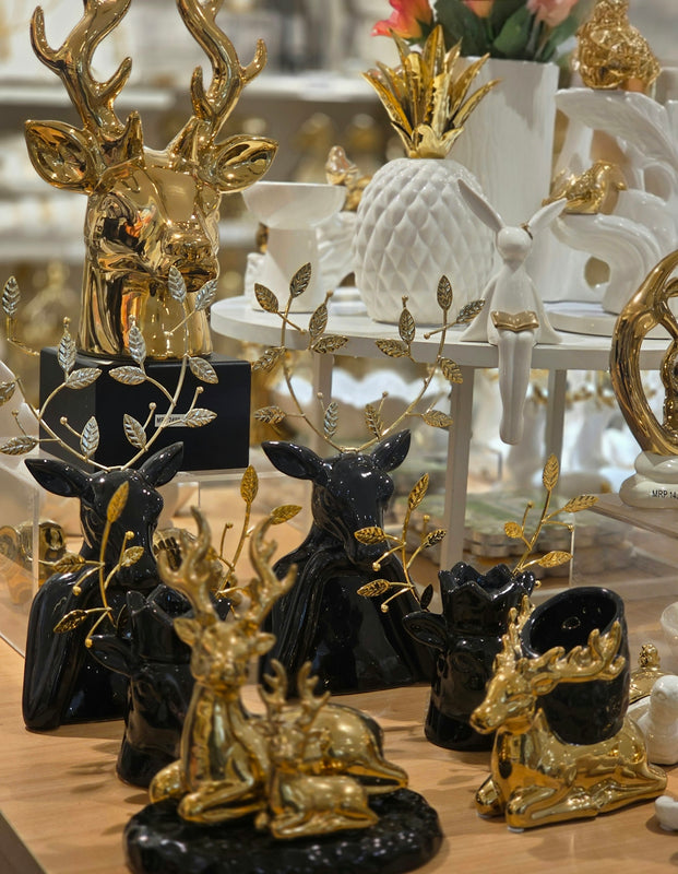 Decorative golden and black animal sculptures on display.