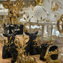 Decorative golden and black animal sculptures on display.